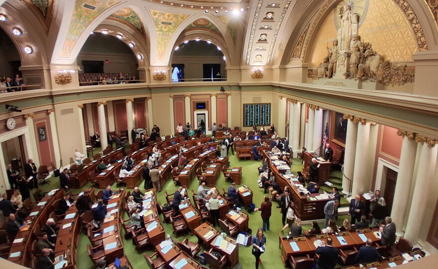 Legislators and staffers fill the floor of the Minnesota House of Representatives on May 7, 2026.