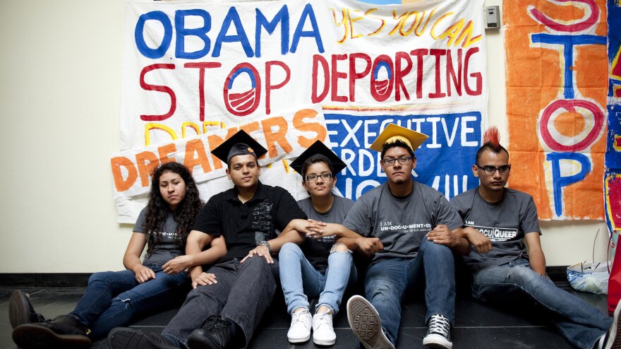 Myisha Areloano, Adrian James, Jahel Campos, David Vuenrostro and Antonio Cabrera camp outside President Obama's campaign headquarters in Culver City, Calif., on Friday to protest his immigration policies.