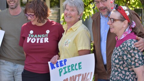 Supporters of a plan to raise sales tax revenue for Pierce Transit gathered outside of the Pierce Transit Training Center before a board meeting to express their hope that members would send the measure to the ballot.