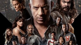  Movie poster for the action film Fast and Furious: Fast X featuring a car race and a group of people in the background