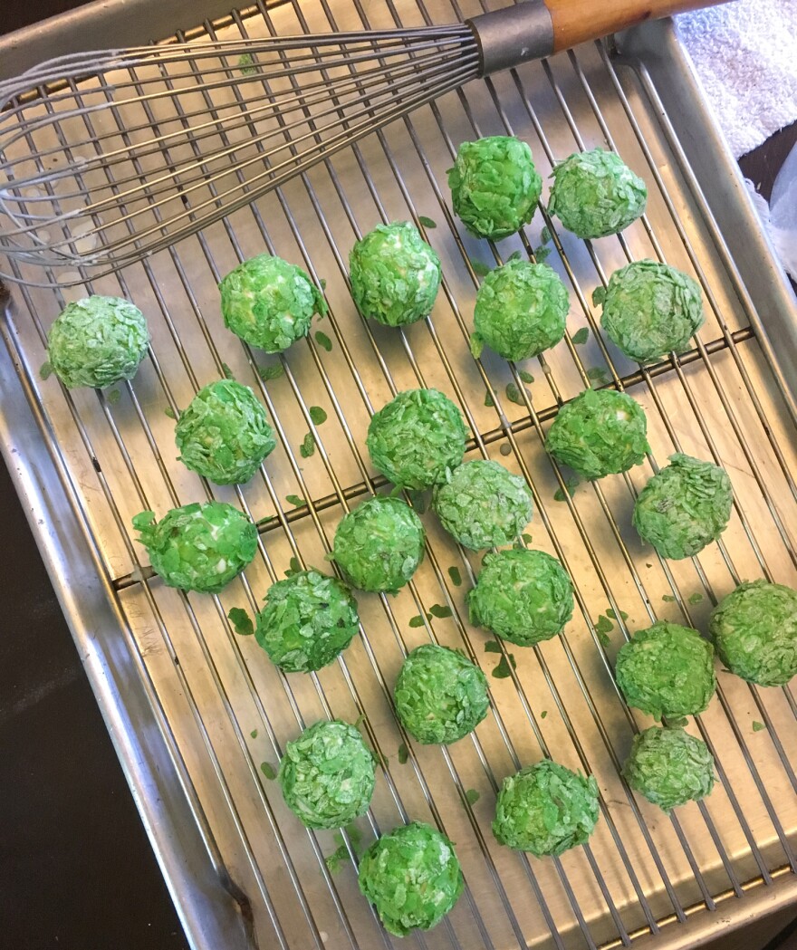 The tofu balls are dipped into a flour and water mix and then coated with crispy green rice.