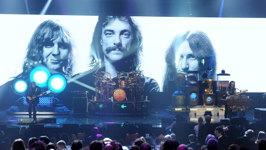 Rush on stage at the 2013 Rock and Roll Hall of Fame induction ceremony.