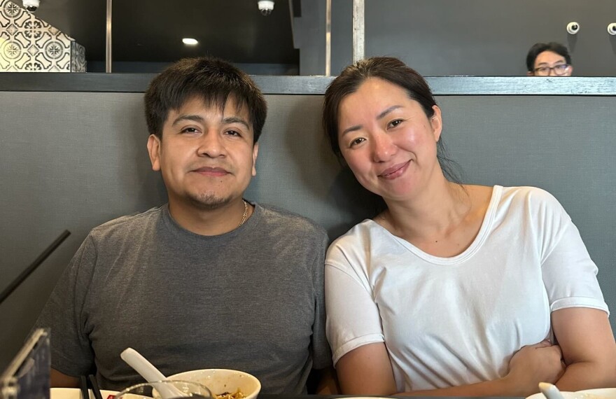Santiago Martinez (left) sits with his boss Jennifer Choi en route to Alaska after being released from ICE detention in Washington state.