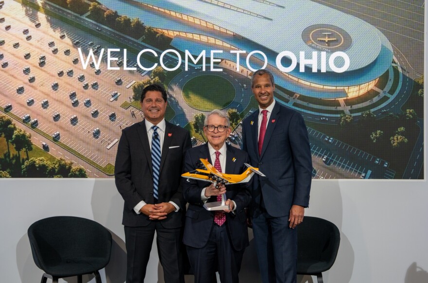JobsOhio President and CEO J.P. Nauseef, Gov. Mike DeWine, and Electra CEO Marc Allen at the Farnborough International Airshow in England.