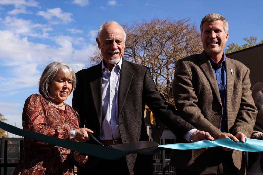 (From left to right) Governor Michelle Lujan Grisham, Albuquerque City Council President Isaac Benton and Albuquerque Mayor Tim Keller cut the ribbon to "open" The Commons at Martineztown