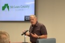 Man speaking in front of a microphone 