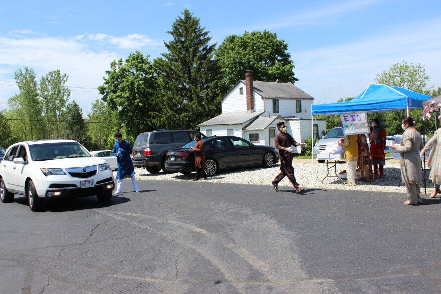 Volunteers took doughnut and tea orders as cars pulled into the parking lot.