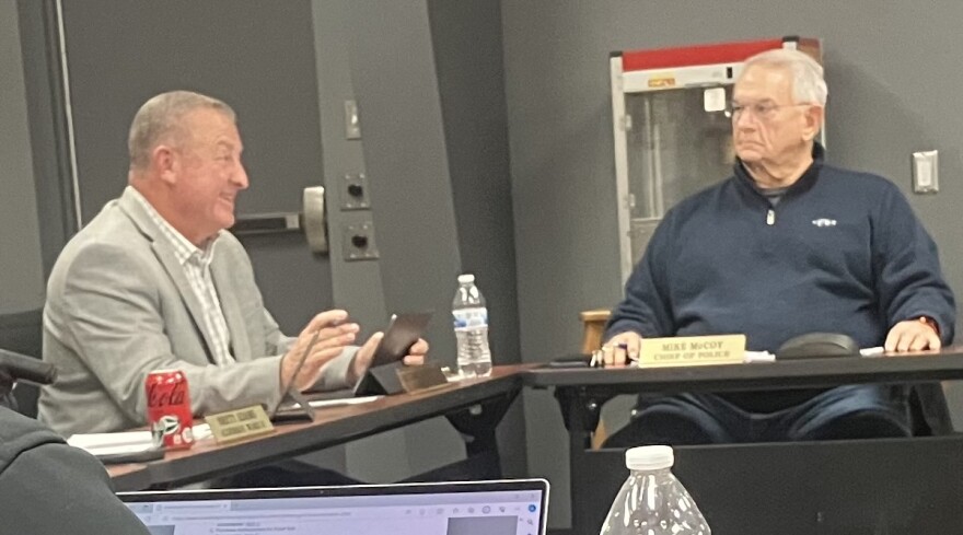 Alderperson Mike Brownfield (left) discusses the importance of Five Points Washington to the city while Police Chief Mike McCoy listens.