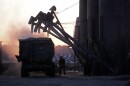 A feed truck is loaded at dawn at the Flood Brothers Farm, Monday, April 1, 2024, in Clinton, Maine. 