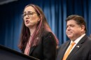 Illinois State Rep. Kelly Cassidy, D-Chicago, speaks as Democratic Gov. JB Pritzker listens on Friday, Jan. 13, 2023. Cassidy is proposing Illinois give a $500 tax credit to physicians and patients fleeing states that are limiting access to health care that is lawful in Illinois – which can include abortion, gender-affirming care and fertility treatments. 