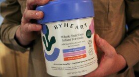 Stephen Dexter holds a container of ByHeart baby formula, which was recently recalled by ByHeart, in Flagstaff, Ariz., on Wednesday, Nov. 12, 2025.