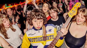 Issley Manzi plays a guitar at a previous Queercore fest