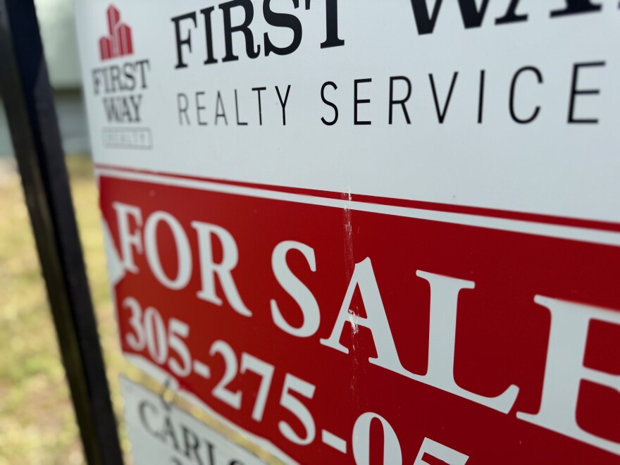 A "for sale" sign hangs outside a Miami-Dade home in Feb. 2026.