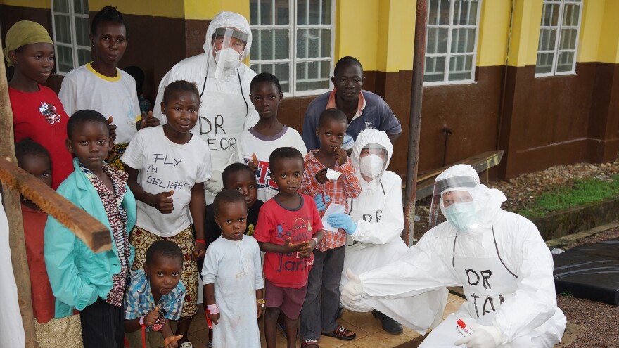 Dr. Risi (top, center) spent a month working with the medical team at Kenema General Hospital, the largest Ebola treatment center in Sierra Leone.