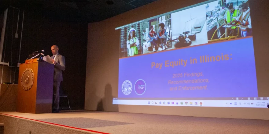 Jason Keller, assistant director of the Illinois Department of Labor, speaks at a seminar about recent findings of a report on pay equity in Illinois. The report is the first released since a 2021 amendment to the Equal Pay Act required certain business owners to report wage and demographic data.