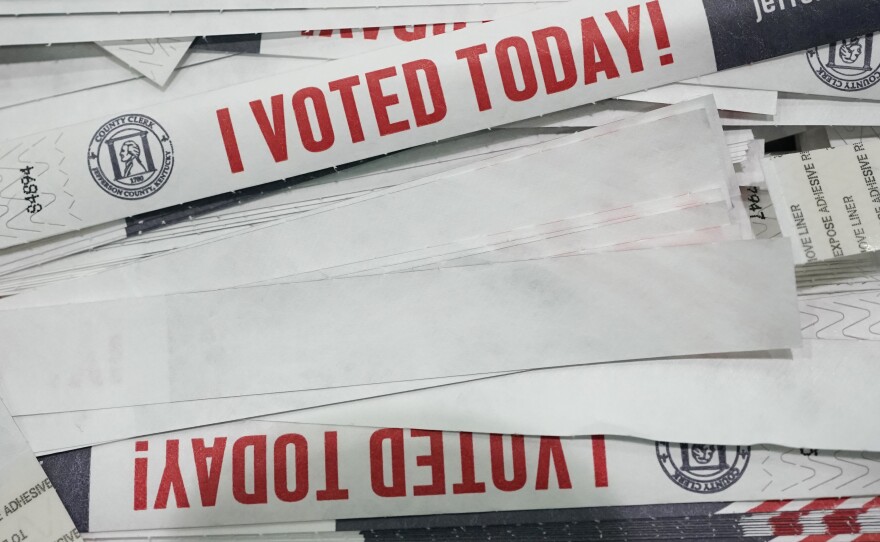Voting armbands are left for voters as they leave the Kentucky Exposition Center, on Election Day, Tuesday, Nov. 3, 2020, in Louisville