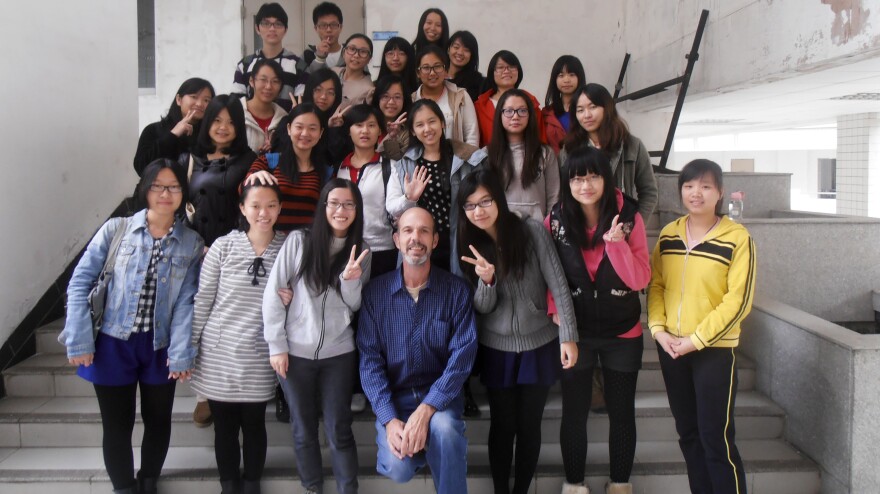 Foster poses with his students at Guangdong University of Foreign Studies.