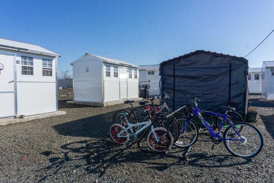 White structures surround a group of bikes
