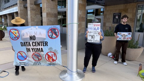 Yuma County residents protest data centers outside a meeting of the Greater Yuma Economic Development Corp. on Friday, April 10, 2026. The majority of protesters went inside the meeting as it was opened to the general public.