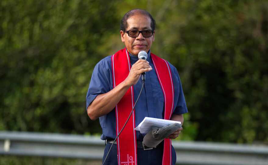 Rev Miguel Estrada with Mision Peniel speaks to the audience 