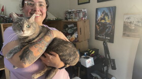 Angel Desrocher, 36, with her cat Bento. She's rented apartments since she graduated college, but she is envious of adults who decided to live at home and build up their savings.