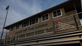 The sun sets on the press box of the Lions Field football stadium at Carterville High School.