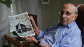 A man on holds a picture 
