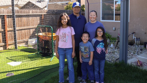 Luke Rou, center, stands from left with two of his sisters, Aubrey and Zoe, and parents Sam and Paule.