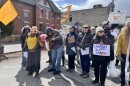 Tannis Kowalchuk, left with microphone, leads the Singing Resistance NEPA choir during a No Kings march in Honesdale.