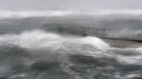 A rough surf surrounds Boynton Beach inlet in Boynton Beach, Fla. (Jim Rassol/South Florida Sun-Sentinel via AP) .