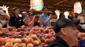 A mix of media and employees record opening day inside Wegmans' new store in Norwalk, their first in Connecticut.