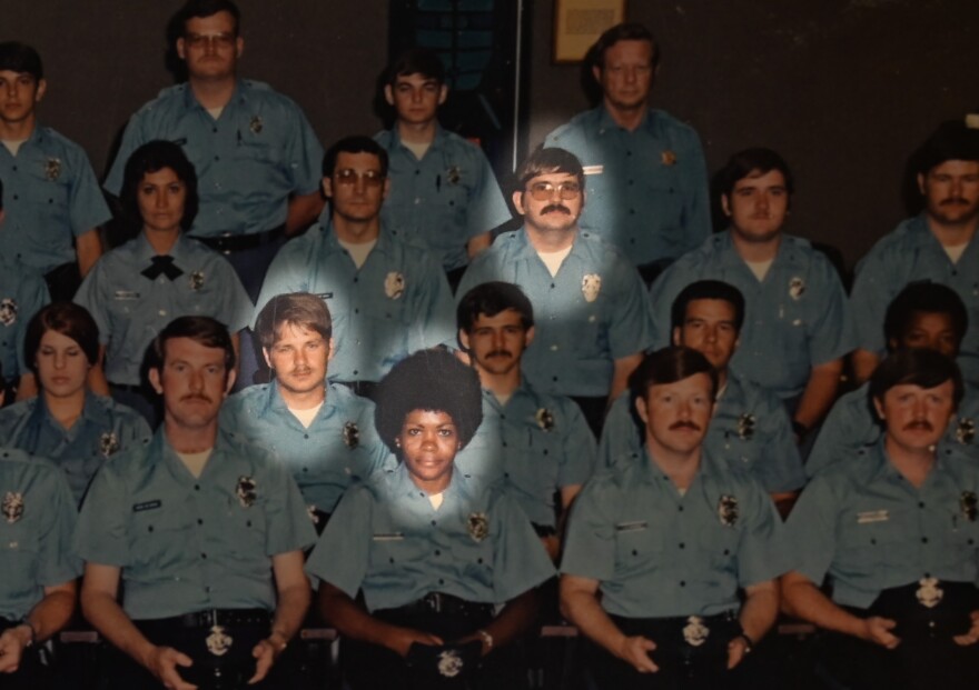 Ruby Ellington in the center of the front row. Roger Golubski is two rows behind her to the right. One row behind her, to the left, is Max Siefert. All three graduated from the police academy in 1975. Seifert describes Golubski as "underhanded."