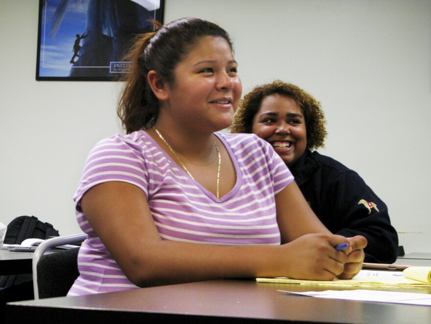 Jackeline Lizama (front) plans to attend a local community college after she graduates next month from her high school in Silver Spring, Md.