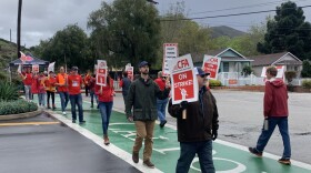 Cal Poly professors, lecturers and faculty picketing at the Grand Avenue entrance.