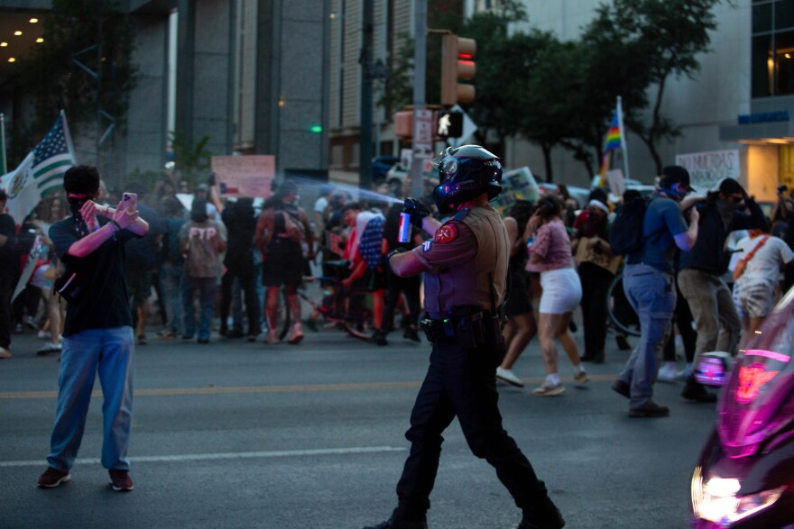 State troopers pepper spray anti-ICE demonstrators in downtown Austin.