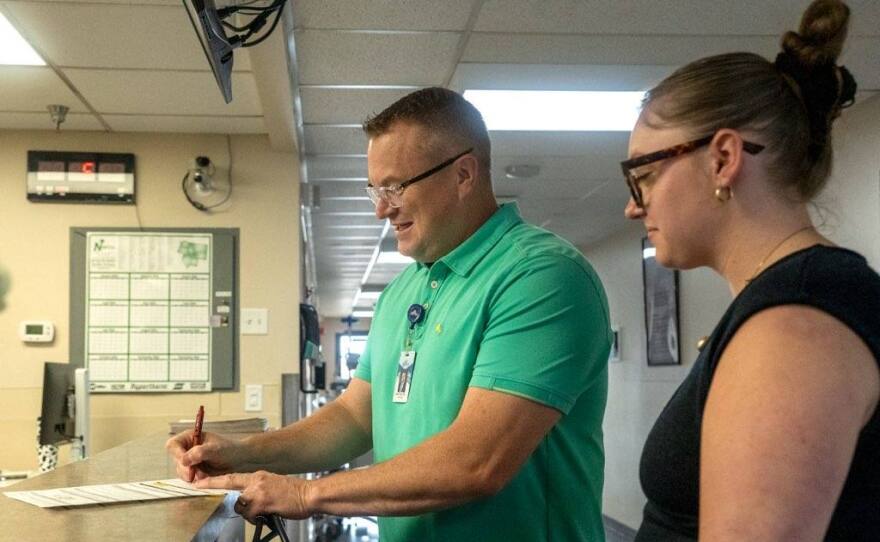 Dr. Matt Told fills out a form at the nurses station as Maddie Sorenson shadows him recently at Syringa Hospital and Clinics in Grangeville.