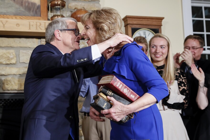 Gov. Mike DeWine hugs First Lady Fran DeWine after being sworn in as governor.