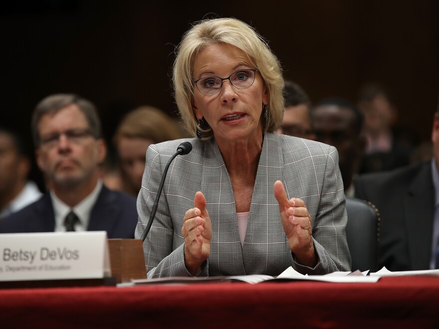 Education Secretary Betsy DeVos is accused of unlawfully delaying a federal rule stemming from the Obama administration.