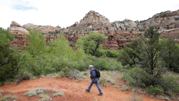 A hiker makes his way up a trail to Calf Creek in the Grand Staircase-Escalante National Monument on May 10, 2017 outside Boulder, Utah. (George Frey/Getty Images)