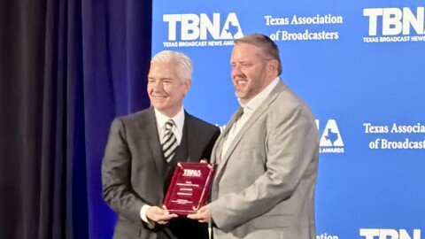 KETR's Jerrod Knight (right) accepts an award plaque from Texas Association of Broadcasters president Oscar Rodriguez (left) at the Texas Broadcast News Awards banquet and ceremony on April 11, 2026 at the Westin Austin at the Domain.
