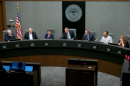 People sitting around a dais