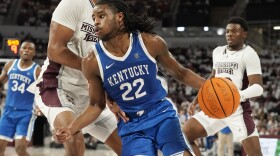 Kentucky guard Cason Wallace (22) presses against Mississippi State forward Tolu Smith (1) as he tries to drive towards the basket during the first half of an NCAA college basketball game in Starkville, Miss., Wednesday, Feb. 15, 2023. (AP Photo/Rogelio V. Solis)