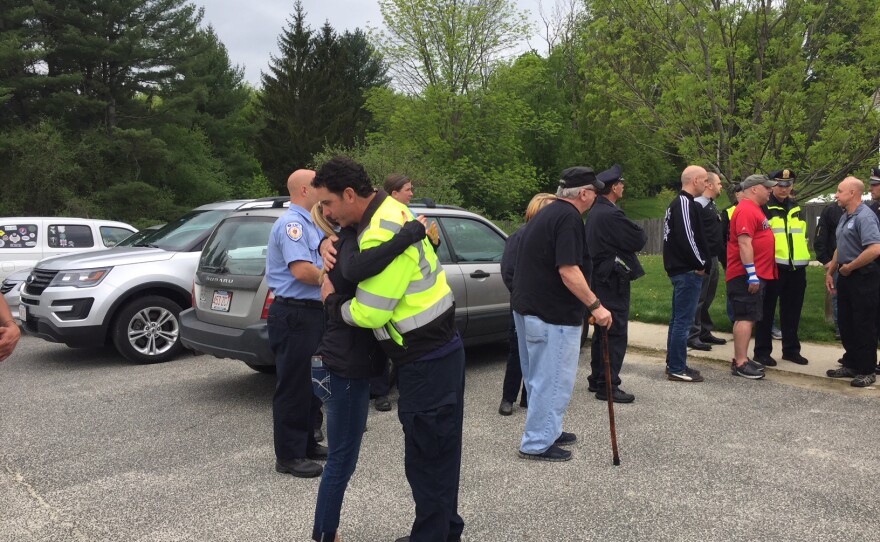 Mourners of Ciro, a retired police dog who had to be euthanized.