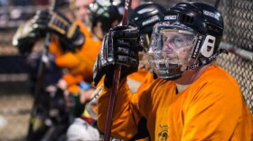 Inline hockey players on bench