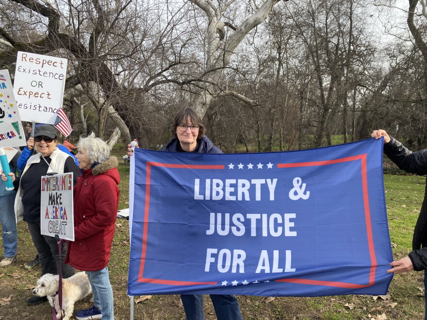People hold up signs during the ‘Free America Walkout’ protest in Chico, Calif., on Wednesday, Oct. 29, 2025.