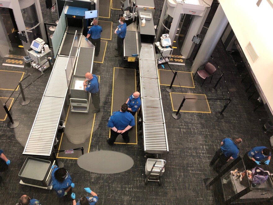 TSA officers stationed at Albany Airport passenger screening checkpoints.