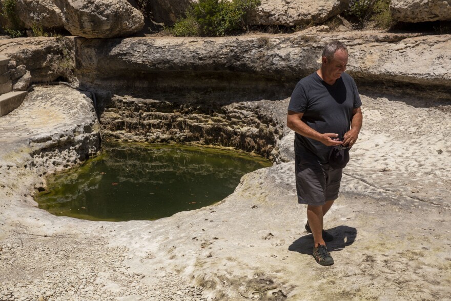 David Baker, founder and director of the Wimberley Watershed Association, said he’s never seen the water level so low in Jacob’s Well, August 2023.