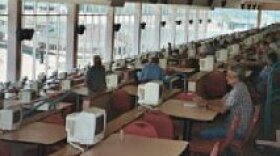 Fans watch the greyhounds run at the Woodlands. Can slots remedy waning attendance?