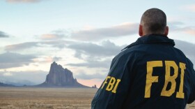  FBI agent in front of Shiprock in the Navajo Nation.