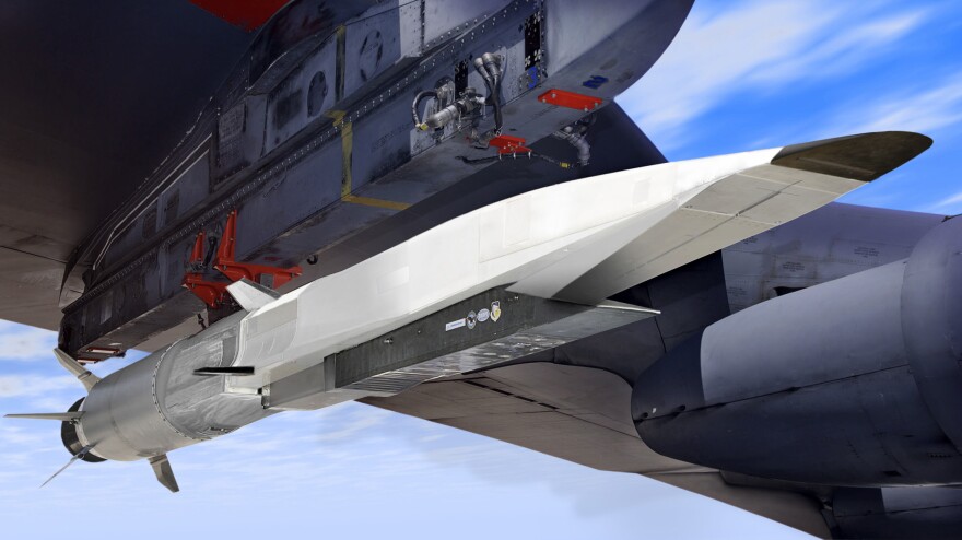 An artist's rendition of an X-51A WaveRider (in white) attached to the wing of a B-52.